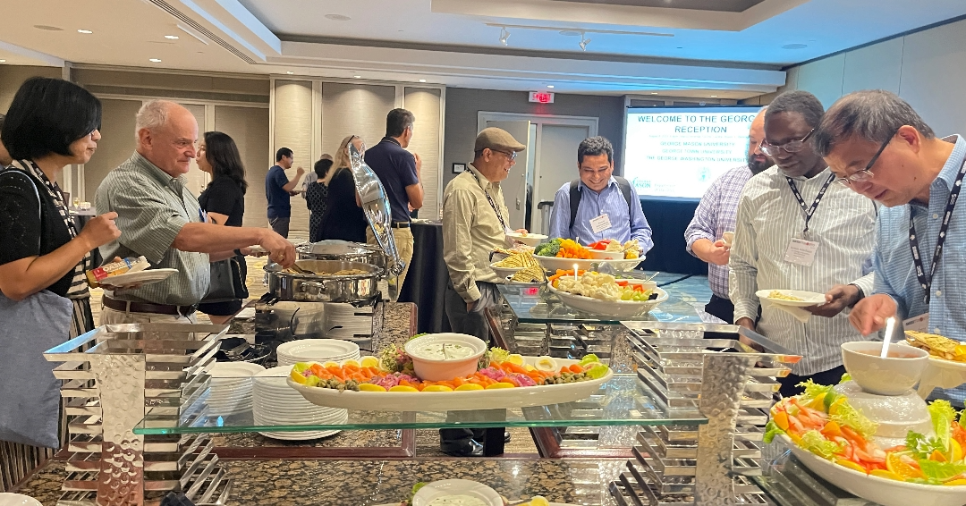Attendees enjoying a buffet at The Georges Reception, JSM 2023.