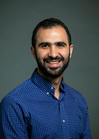 Khaled Khasawneh wears a blue, button-down shirt in his faculty profile at the Department of Electrical and Computer Engineering