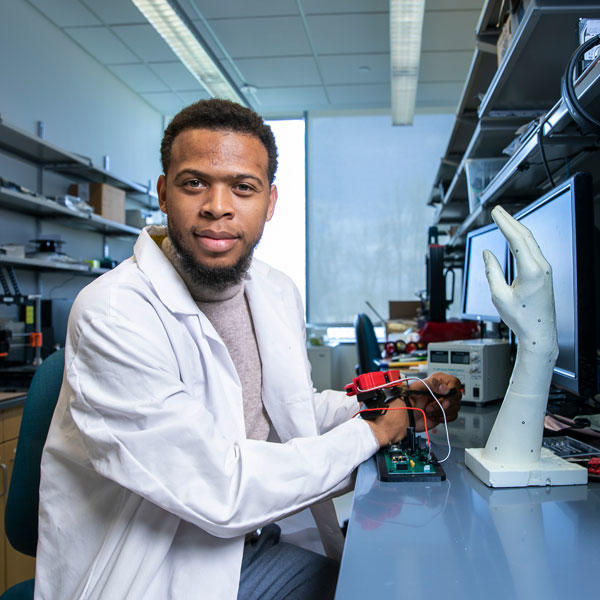 Bioengineering Associate Professor Quentin Sanders with his robotic arm device