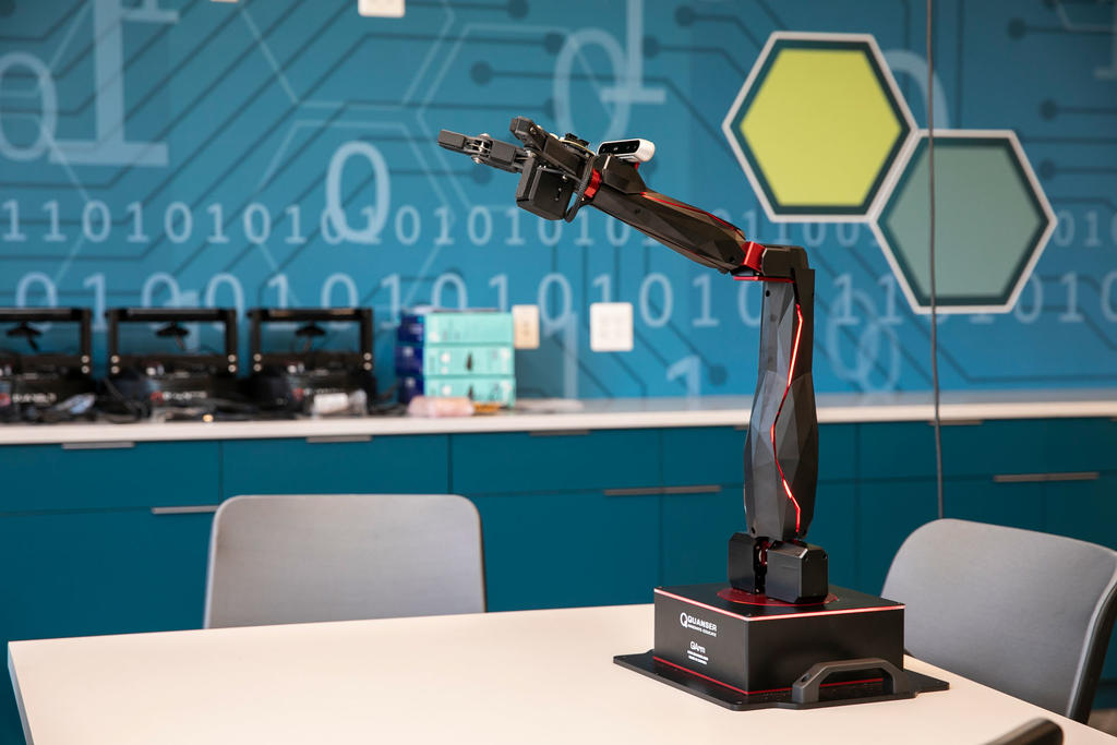 A black and red robotic arm in a cybersecurity lab at George Mason University