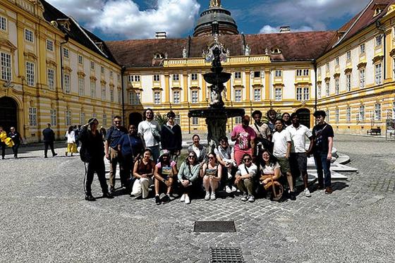 Computer science students in front of Melk Abbey