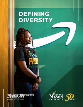 Britney Aiken, a black woman and CEC Information Technology alum, smiles in front of the Amazon sign with a Mason alumni t-shirt.