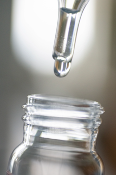 Pipette dropping water into vial
