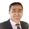 Mohamed Ibrahem, Mason CYSE assistant professor, wears a dark suit and tie, and white shirt in his profile
