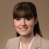 Mason civil engineering associate chair Laura Kosoglu wears a tan suit in her faculty profile