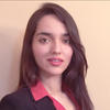 Hussna Azamy wears a pink collared shirt and dark blazer