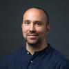 Evgenios wears a dark-blue shirt