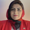 Humaira Akhtari wears a sophisticated red scarf and blazer